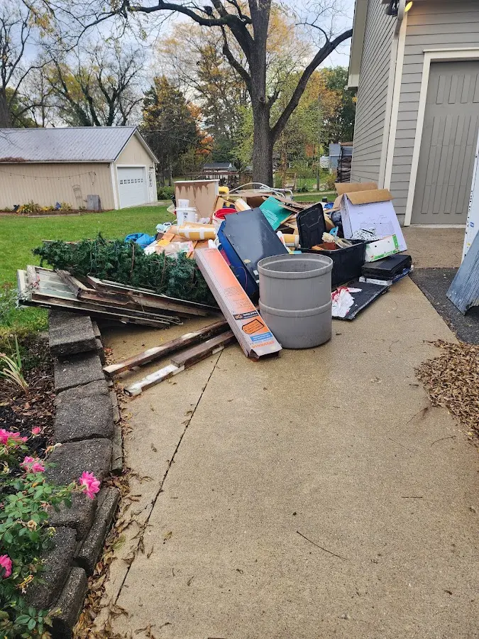 Dumpster being loaded with debris for 10 Yard Dumpster Rental in Boston